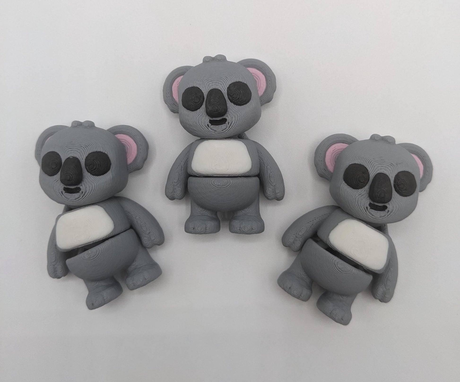 Bring cuteness and relaxation to your day with the Adorable Tiny Articulated Koala Fidget Toy! This charming 3D-printed koala is designed with  articulated joints, making it perfect for fidgeting, creative play, or as a fun pocket sized friend!