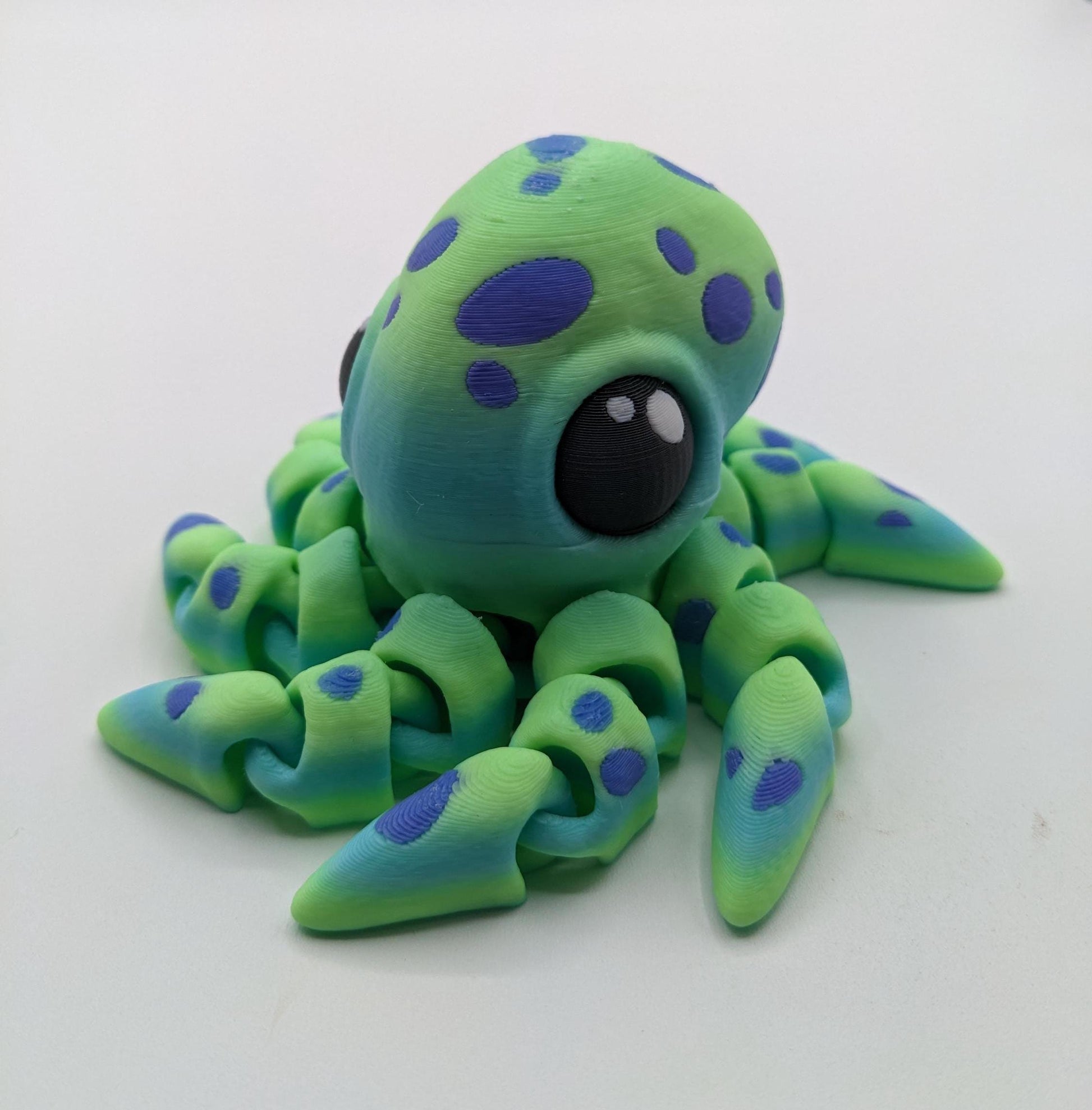 Dive into a world of cuteness and fun with the Adorable Articulated Tiny Octopus! This charming 3D-printed octopus features fully articulated tentacles, making it perfect as a relaxing fidget toy, a playful desk companion