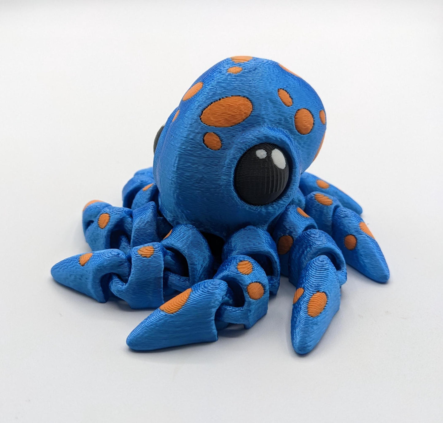Dive into a world of cuteness and fun with the Adorable Articulated Tiny Octopus! This charming 3D-printed octopus features fully articulated tentacles, making it perfect as a relaxing fidget toy, a playful desk companion