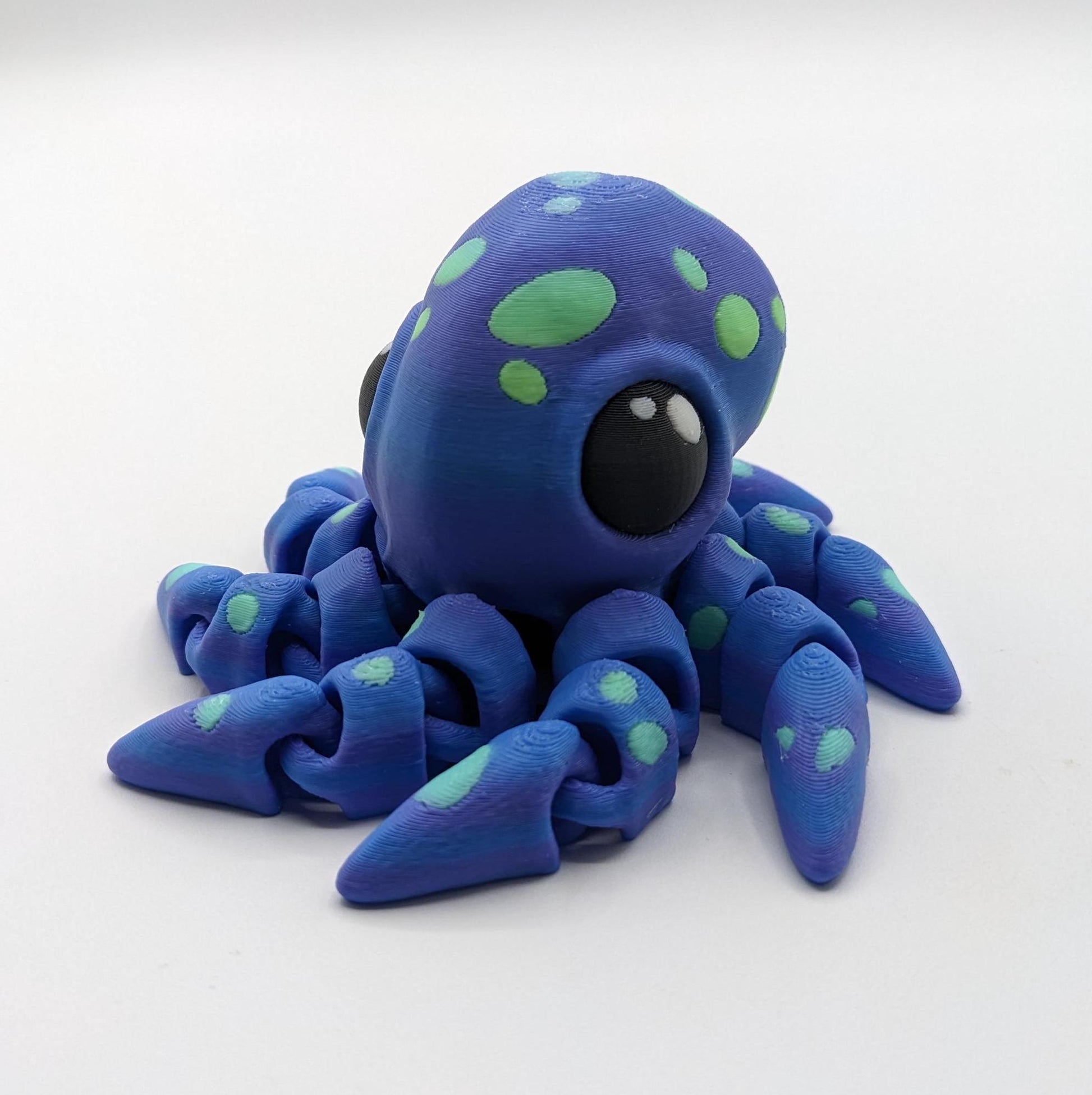 Dive into a world of cuteness and fun with the Adorable Articulated Tiny Octopus! This charming 3D-printed octopus features fully articulated tentacles, making it perfect as a relaxing fidget toy, a playful desk companion