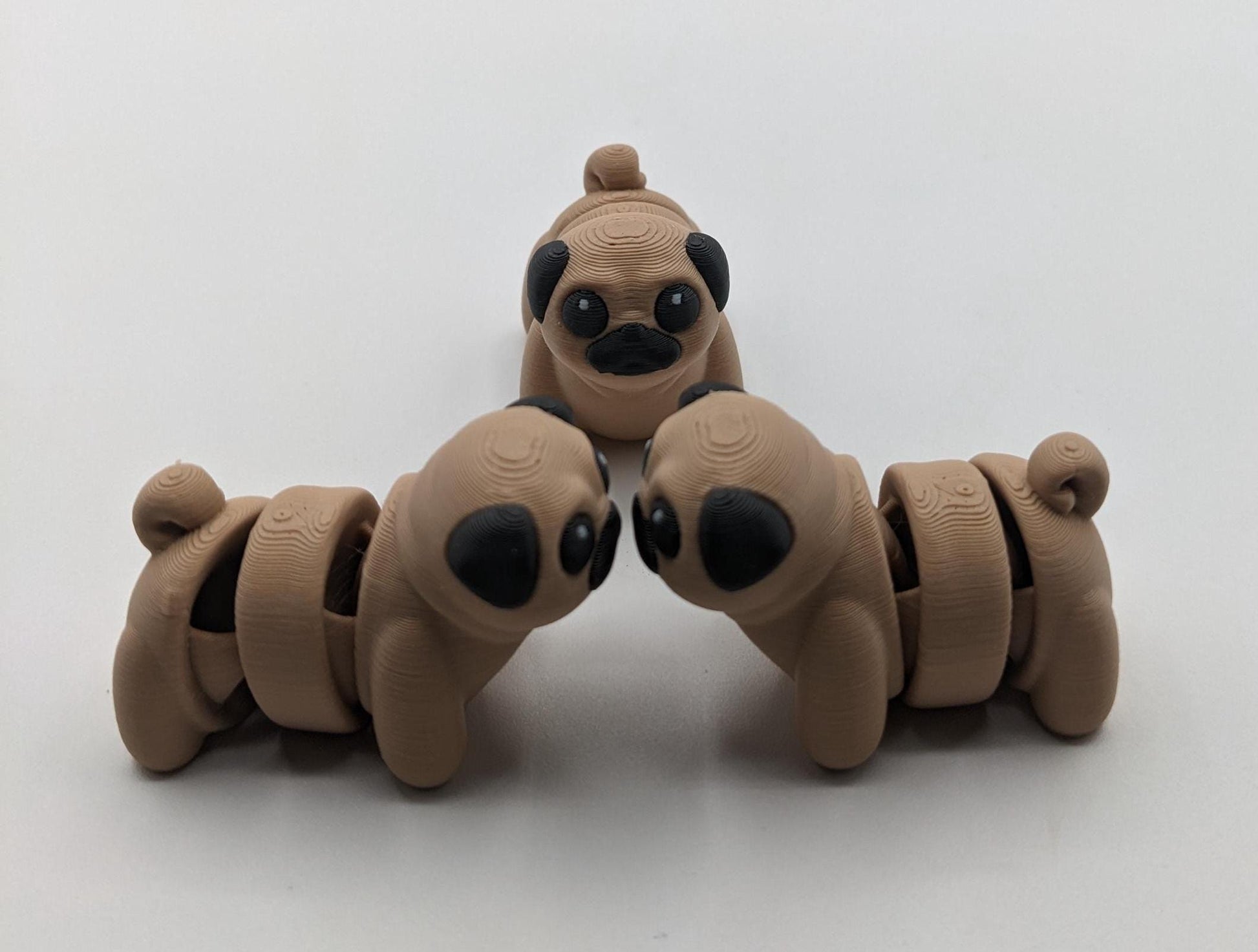 Say hello to the Adorable Articulated Pug Dog Fidget Toy, the perfect combination of cuteness and functionality! Whether you’re a pug lover, a fidget toy enthusiast, or looking for a unique gift, this playful pup is sure to bring joy to your day.