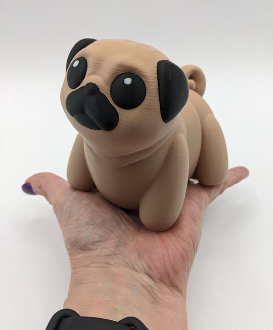 Man&#39;s best friend & the clown of the dog breeds, our adorable pug with it&#39;s larger size makes it even more fun to handle, while capturing the mischievous charm of your puggy friend. Whether you’re looking for a unique gift, a relaxing fidget toy, or a playful decoration, this pug puppy will bring endless joy & stress relief.