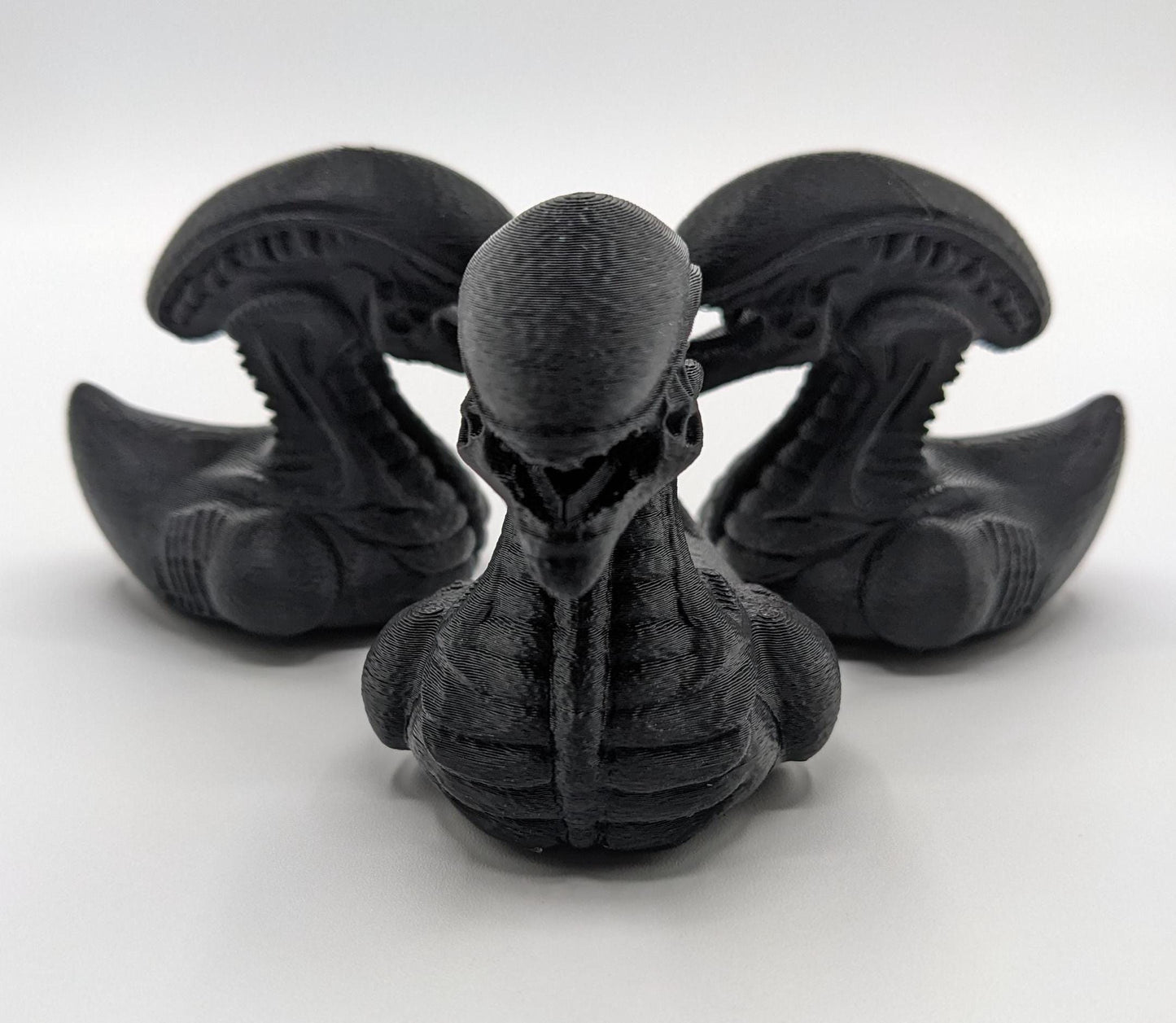 Step into the world of sci-fi and whimsy with the Alien Xenomorph Duck! This one-of-a-kind 3D-printed creation combines the eerie, iconic design of an alien xenomorph with the playful charm of a duck. Perfect for fans of alien creatures, sci-fi enthusiasts, Jeep duck collectors, or anyone who loves quirky collectibles, this hybrid figurine is sure to stand out in any collection.